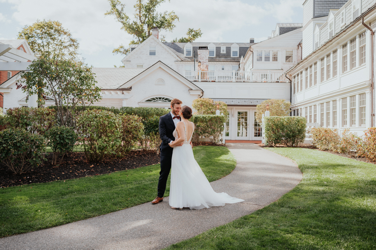 Photo of a couple in Boston, Massachusetts. Bride and Groom Seeing each other for the first time, the Groom crying from joy in front of a big white estate venue